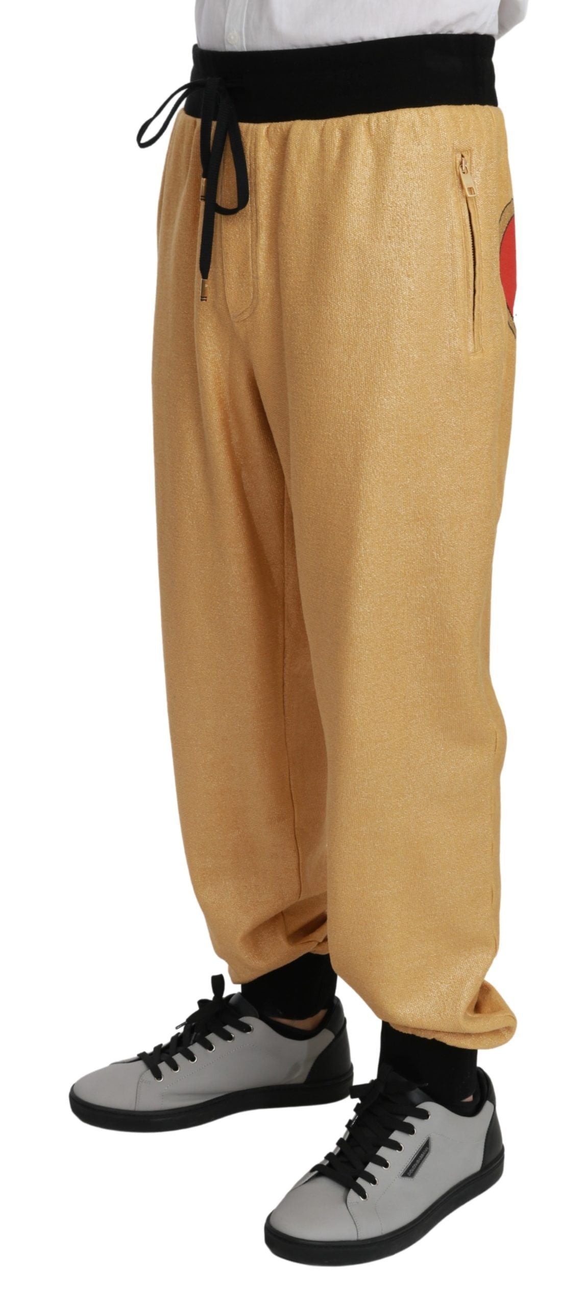 Dolce & Gabbana Elegant Gold Motif Sweatpants - The Home of Luxury